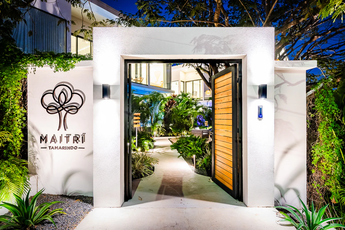Elegant Villa Entrance with Lush Greenery